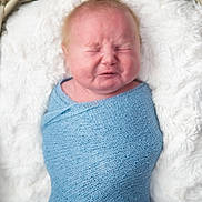 Leyland is registered to the contest to win money with this photo: baby, newborn, wrapped, blue_blanket, basket, fluffy, white_cushion, cute, infant, portrait, sleeping_face, hair_tuft, cozy, indoor, soft_texture, child, laying_down, cute_expression, closeup, peaceful