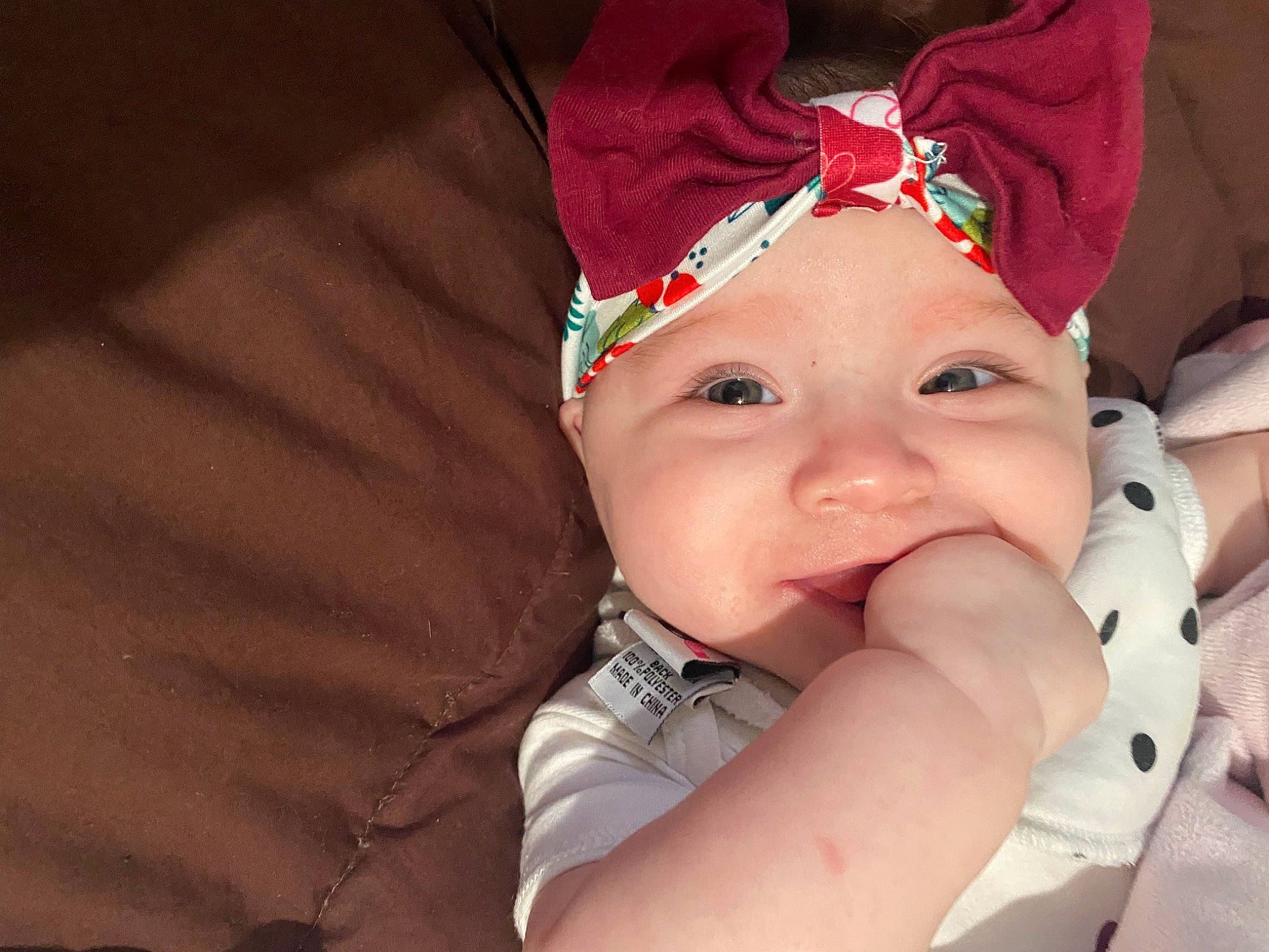 Rosemary is registered to the contest to win money with this photo: baby, cap, cheek, child, chin, costume_hat, event, eye, eyebrow, face, fashion_accessory, fun, hair_accessory, happy, headgear, headwear, lip, mouth, nose, person