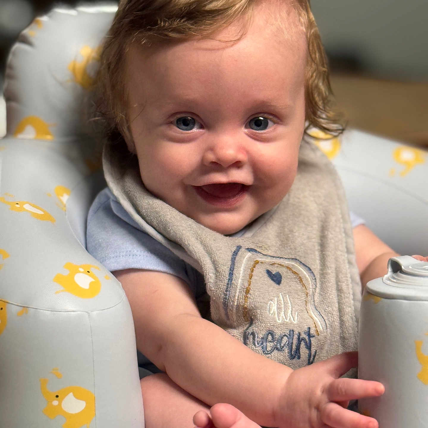 Asher joined the competition — help win amazing prizes! baby, bodypart, chair, clothing, couch, cushion, face, finger, furniture, hand, happy, head, homedecor, person, photography, portrait, sitting, smile, t_shirt, tin