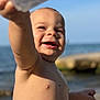 Daelen is registered to the contest to win money with this photo: toddler, child, smiling, beach, water, sand, sunlight, happy, face, arm, skin, outdoor, nature, ocean, sea, baby, summer, portrait, closeup, playful