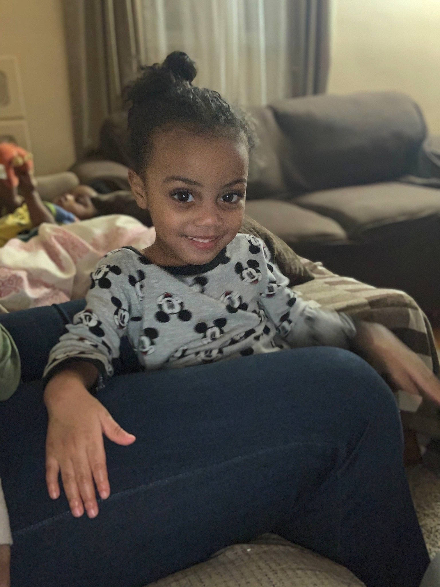 Jamir joined the competition — help win amazing prizes! baby_toddler_clothing, comfort, curtain, eye, hairstyle, joy, lap, living_room, long_sleeved_t_shirt, mouth, nose, person, room, sitting, thigh, window_treatment