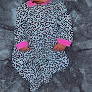 Gianna is registered to the contest to win money with this photo: baby, infant, onesie, leopard_print, pink, pacifier, blanket, soft_texture, lying_down, cute, face, hands, feet, sleepwear, cozy, portrait, child, newborn, indoor, casual