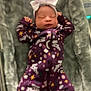 newborn, baby, sleeping, onesie, purple_clothing, headband, bow, blanket, soft_texture, infant, cute, cozy, patterned_clothing, stars, animals, sleep, resting, baby_girl, portrait, indoor