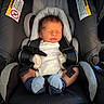 Branden joined the competition — help win amazing prizes! baby, newborn, car_seat, sleeping, infant, clothing, stripes, socks, child, seatbelt, safety, cute, resting, indoors, soft_lighting, person, small, head, peaceful, wrapped