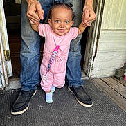 Arabella joined the competition — help win amazing prizes! toddler, child, adult, hands, doorway, pink_outfit, socks, smile, first_steps, floor, wooden_floor, jeans, shoes, indoors, door, pacifier_clip, person, helping, happy, standing