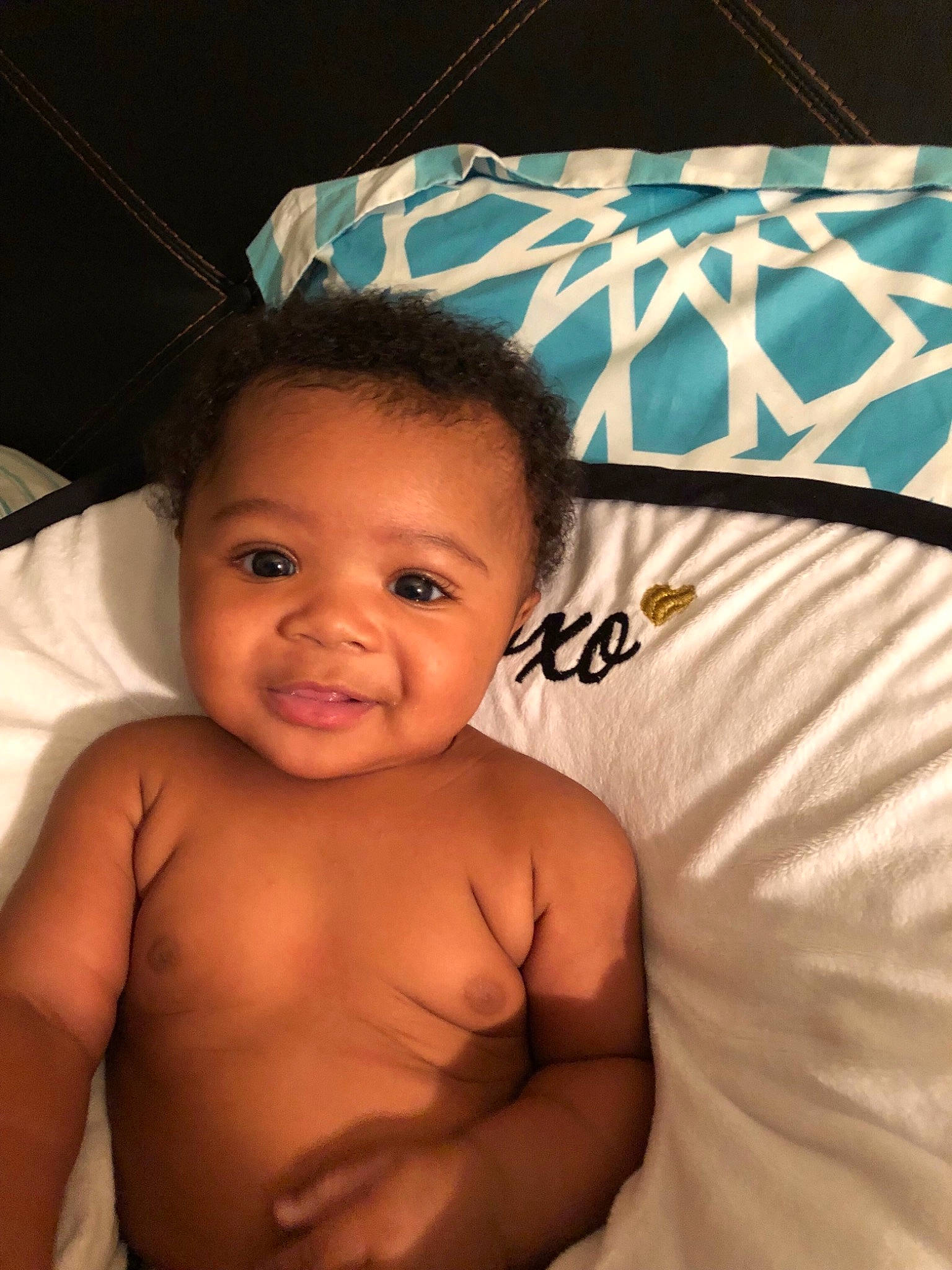 Maleah is registered to the contest to win money with this photo: abdomen, arm, baby, barechested, cheek, chest, child, eye, face, muscle, person, skin, smile, toddler, trunk