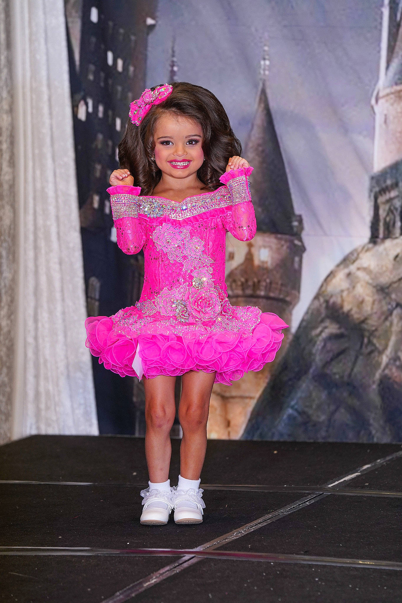 Ryver is registered to the contest to win money with this photo: child, curtain, dress, entertainment, event, fashion_accessory, fashion_design, formal_wear, fun, happy, haute_couture, human_leg, joy, magenta, performing_arts, person, pink, purple, sandal, smile