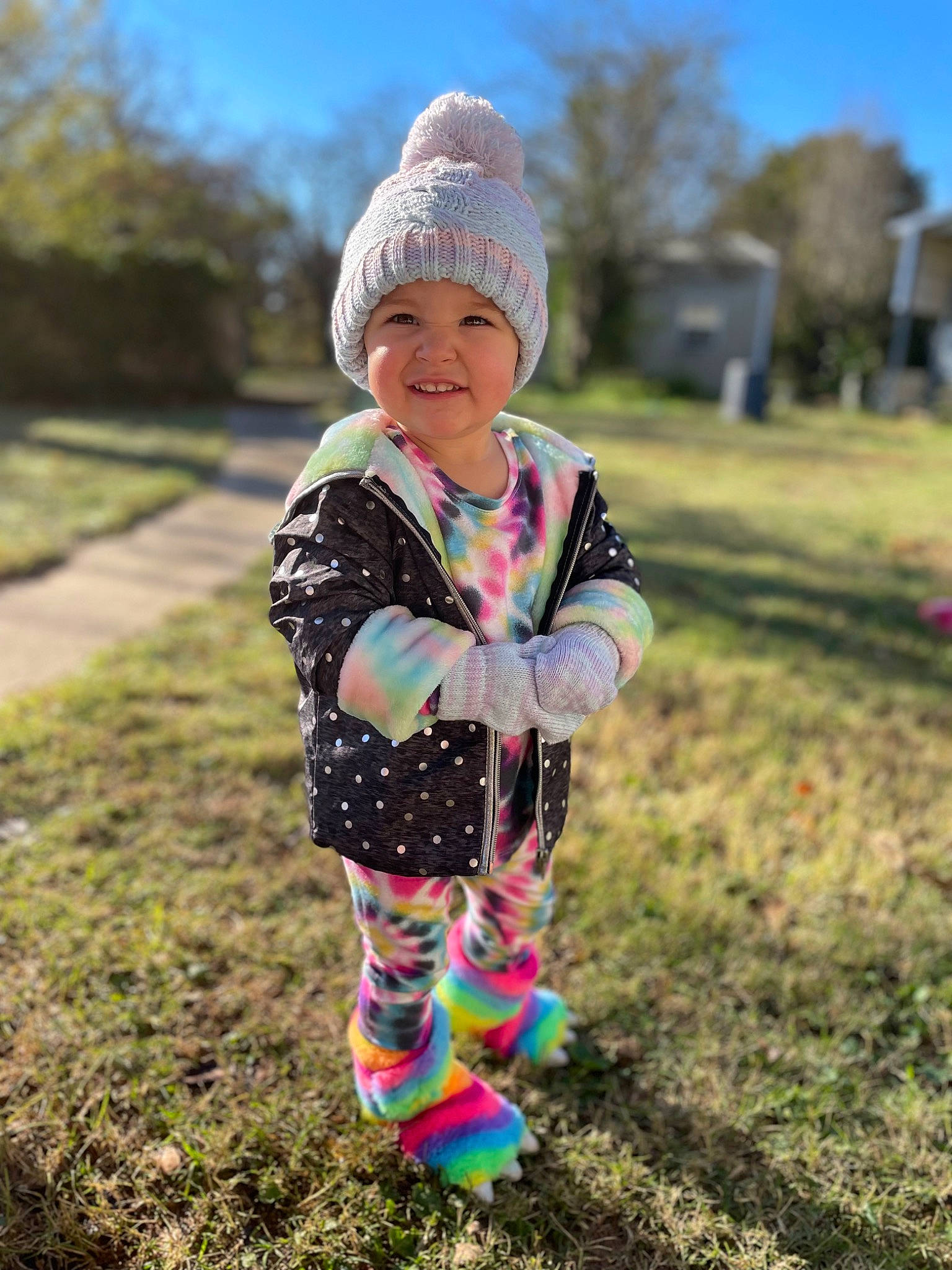 Jaslyn is registered to the contest to win money with this photo: baby_toddler_clothing, face, grass, happy, headwear, jacket, joy, leaf, morning, nature, outerwear, people, people_in_nature, person, plant, sky, sleeve, smile, street_fashion, summer