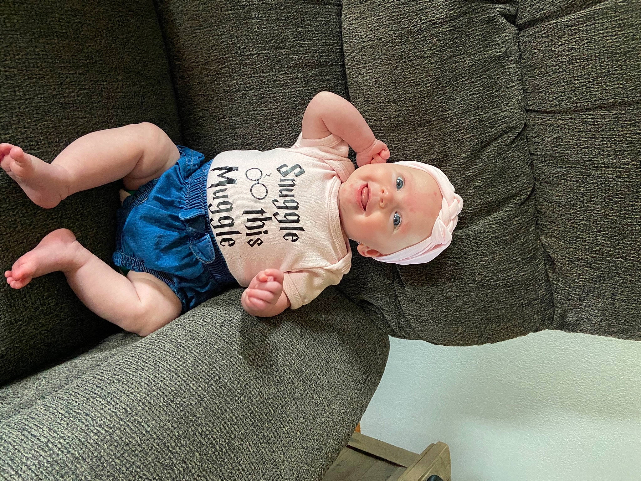 Mayleigh is registered to the contest to win money with this photo: baby, baby_toddler_clothing, barefoot, child, comfort, eye, foot, glasses, hat, head, headgear, headwear, human_body, human_leg, jeans, knee, leg, person, skin, sleeve