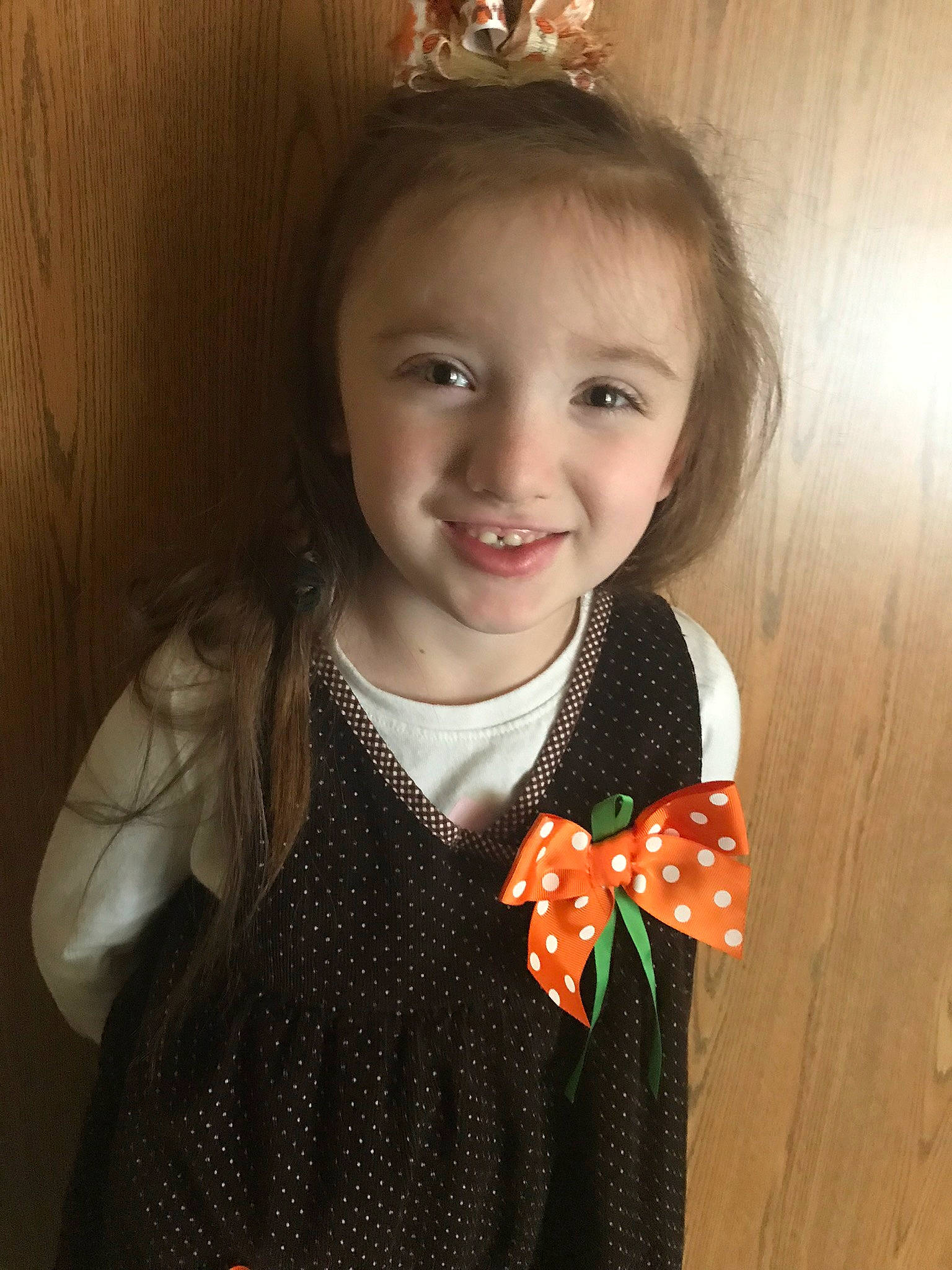 Carrie is registered to the contest to win money with this photo: cheek, child, child_model, dress, ear, face, fashion_accessory, finger, hair_accessory, iris, joy, lip, neck, person, plant, skin, smile, toddler