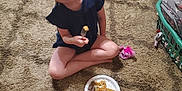 Ava joined the competition — help win amazing prizes! child, carpet, food, fork, plate, sitting, smile, living_room, couch, laundry_basket, toy, paper_plate, breakfast, floor, person, indoor, clothing, hair, cute, home