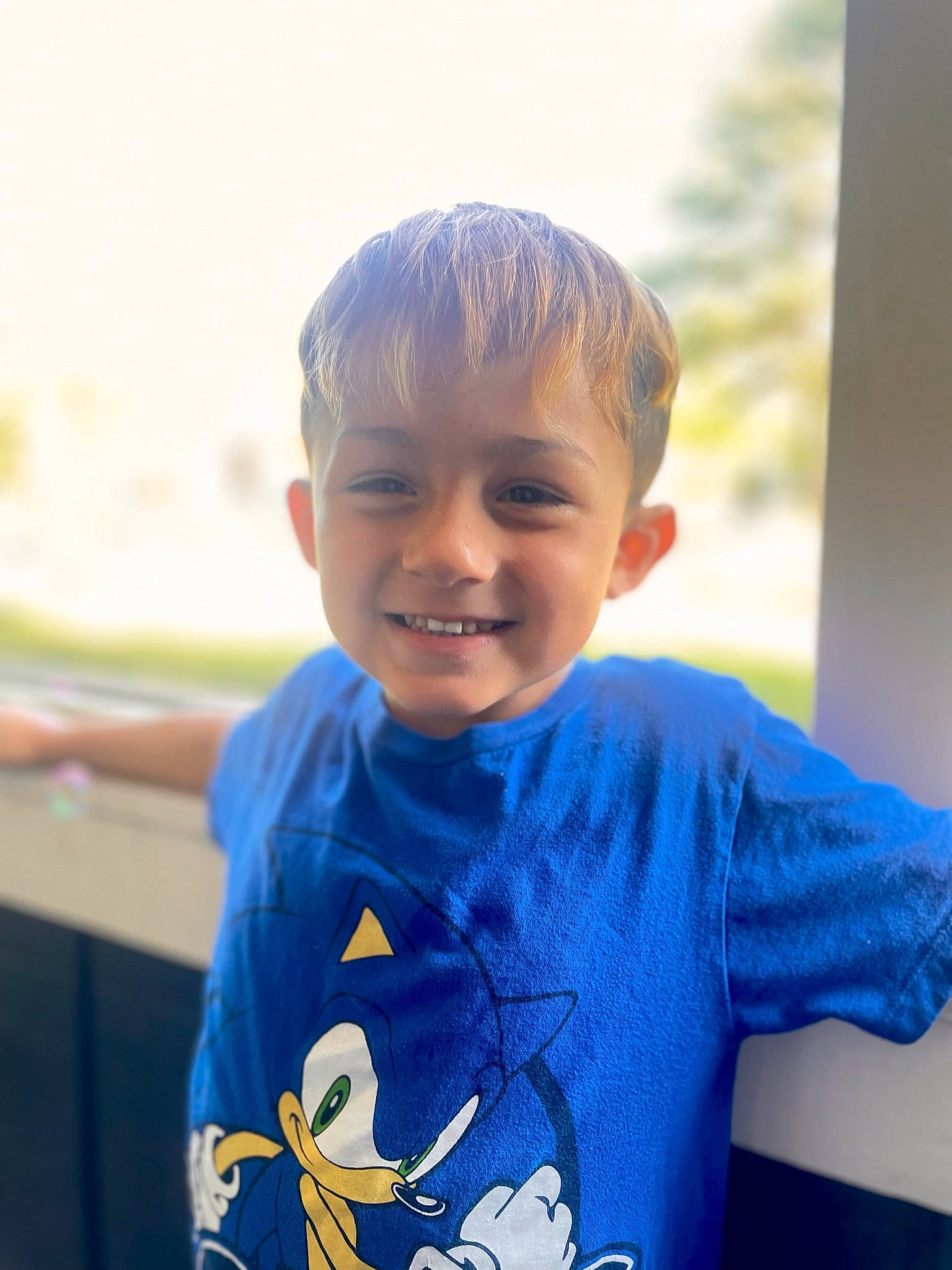 Dominick is registered to the contest to win money with this photo: child, electric_blue, fun, happy, head, human_body, joy, laugh, leisure, neck, ocean, person, play, portrait_photography, recreation, sleeve, smile, t_shirt, toddler, top