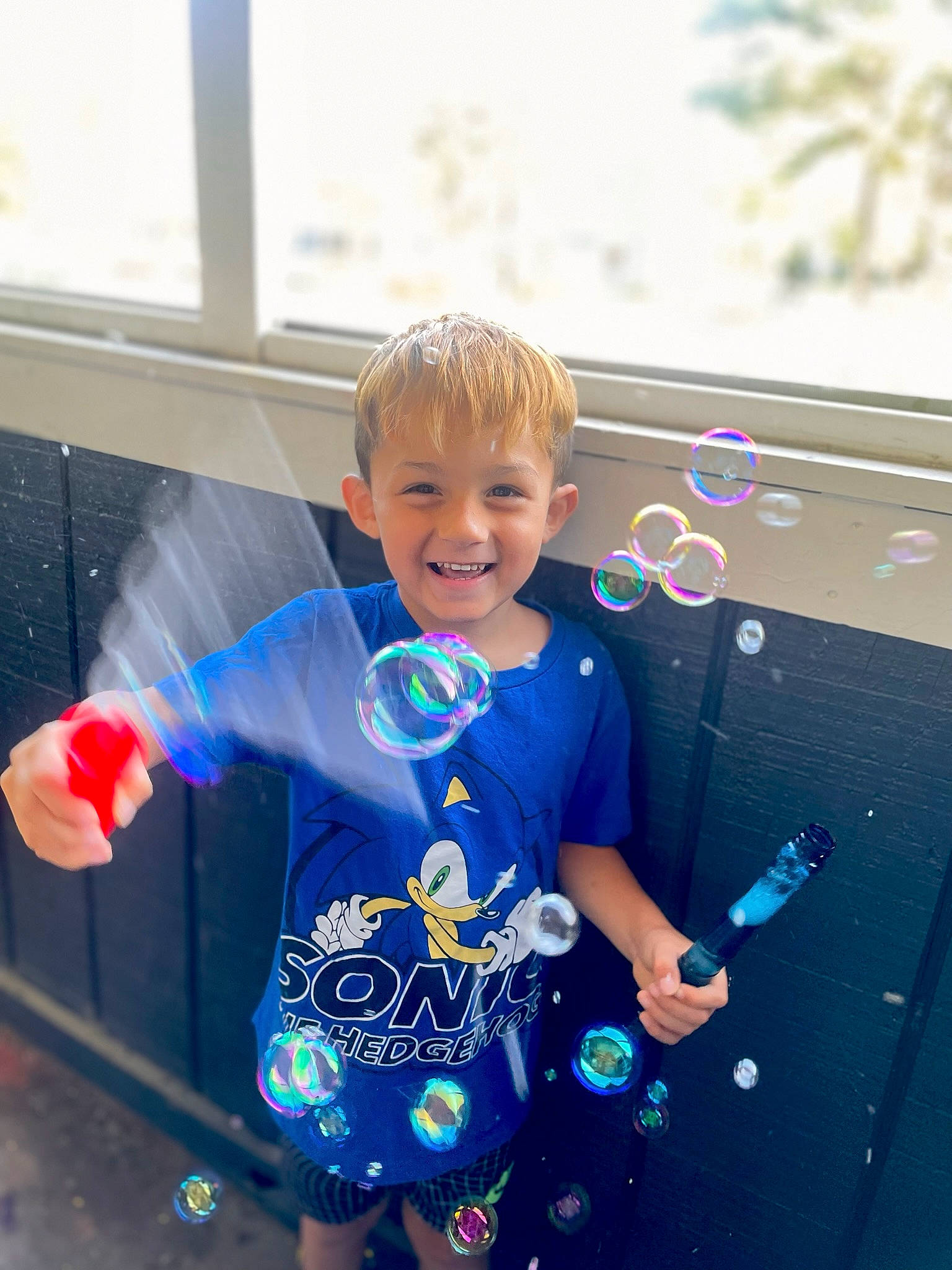 Dominick is registered to the contest to win money with this photo: azure, baby_toddler_clothing, child, city, electric_blue, event, fun, happy, joy, leisure, party_supply, pattern, person, play, recreation, sitting, sleeve, smile, standing, t_shirt