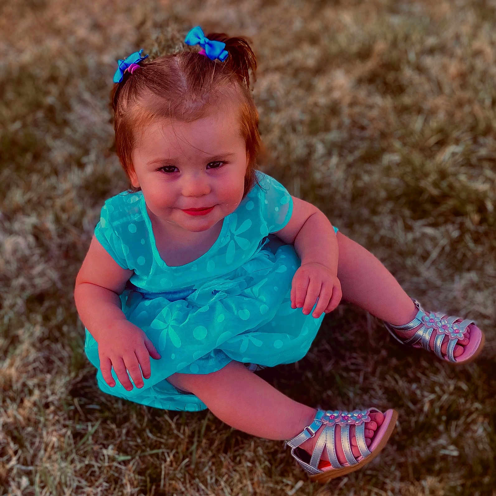 Aubree joined the competition — help win amazing prizes! blue_dress, bows, child, cute, daylight, feet, grass, happy, legs, nature, outdoor, person, playful, portrait, sandals, sitting, smile, summer, toddler, young_child