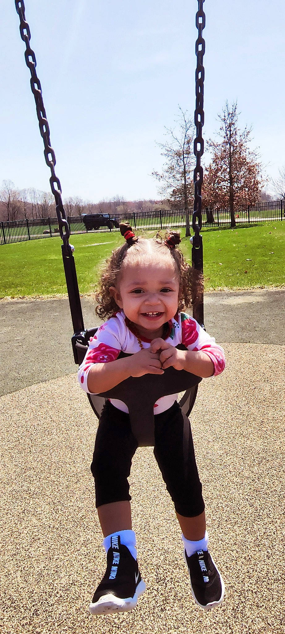 Lyanna joined the competition — help win amazing prizes! cool, facial_expression, finger, fun, gesture, grass, happy, joy, leaf, leisure, nature, people_in_nature, person, pink, plant, sky, sleeve, smile, standing, swing