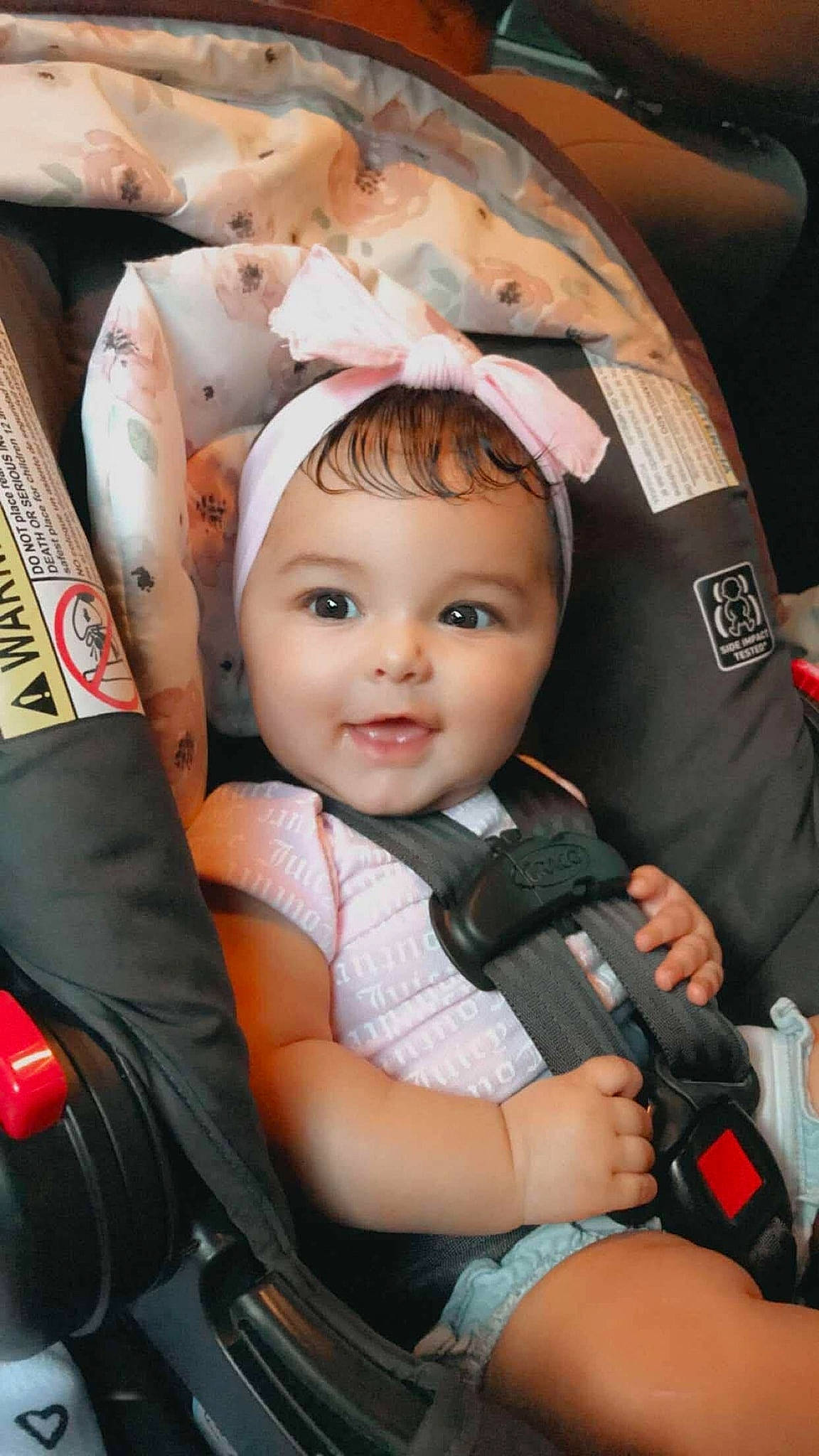 Ellie is registered to the contest to win money with this photo: auto_part, baby, baby_carriage, baby_products, baby_toddler_clothing, car_seat, cheek, comfort, eye, facial_expression, flash_photography, fun, happy, headwear, iris, person, product, seat_belt, skin, smile