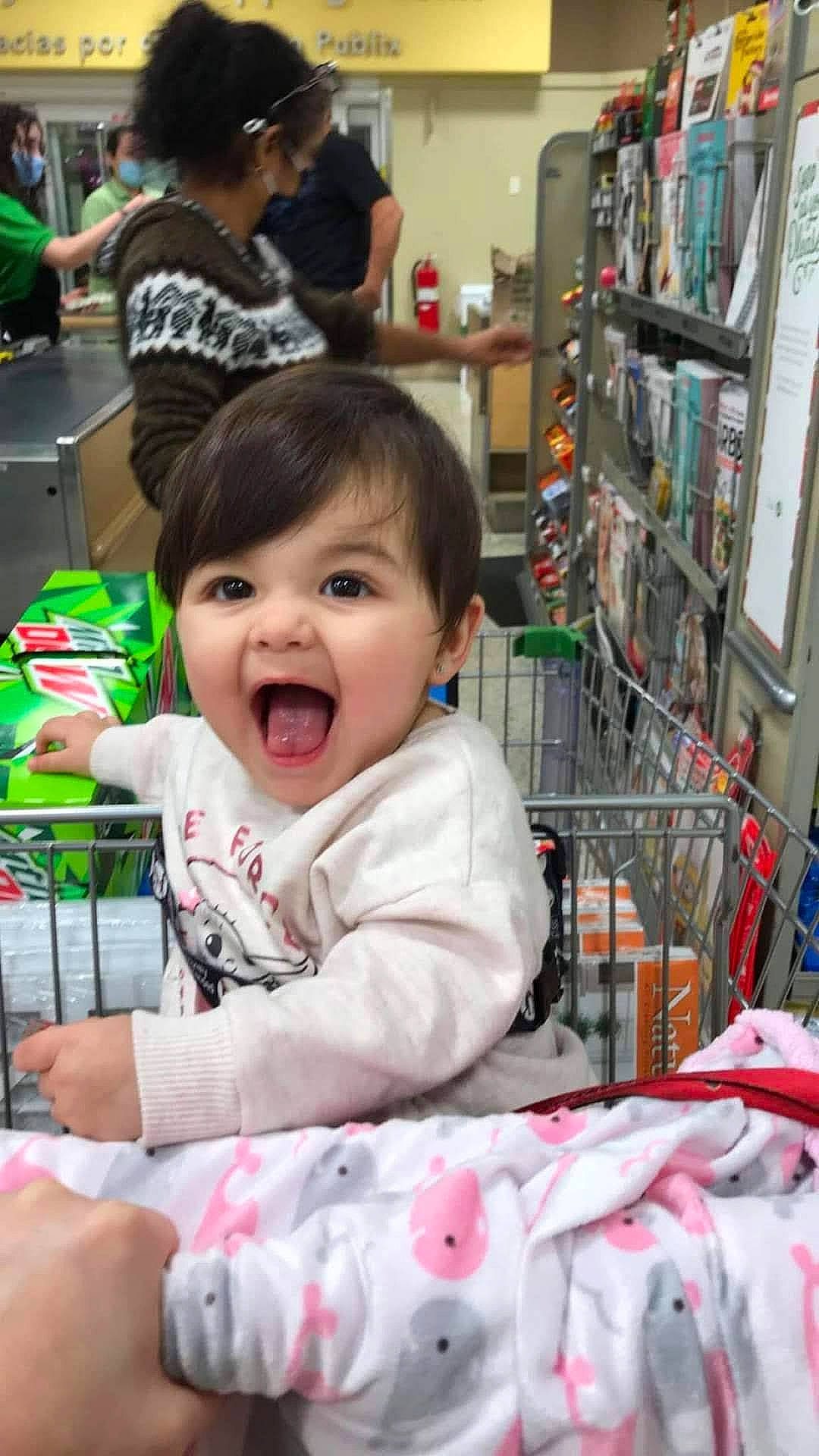 Ellie joined the competition — help win amazing prizes! baby, baby_toddler_clothing, beauty, child, customer, event, fun, happy, person, product, public_space, retail, shelf, shelving, shopping, shopping_cart, skin, smile, snapshot, t_shirt