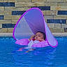 Lylah joined the competition — help win amazing prizes! baby, pool, inflatable, water, relaxing, child, floating, pink, sunshade, swimming_pool, stone_wall, summer, outdoor, vacation, leisure, infant, calm, recreation, fun, daytime
