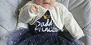 Mayleigh is registered to the contest to win money with this photo: baby, blanket, clothing, coat, couch, cushion, dress, face, furniture, head, homedecor, jeans, longsleeve, newborn, pants, person, photography, portrait, sitting, sleeve