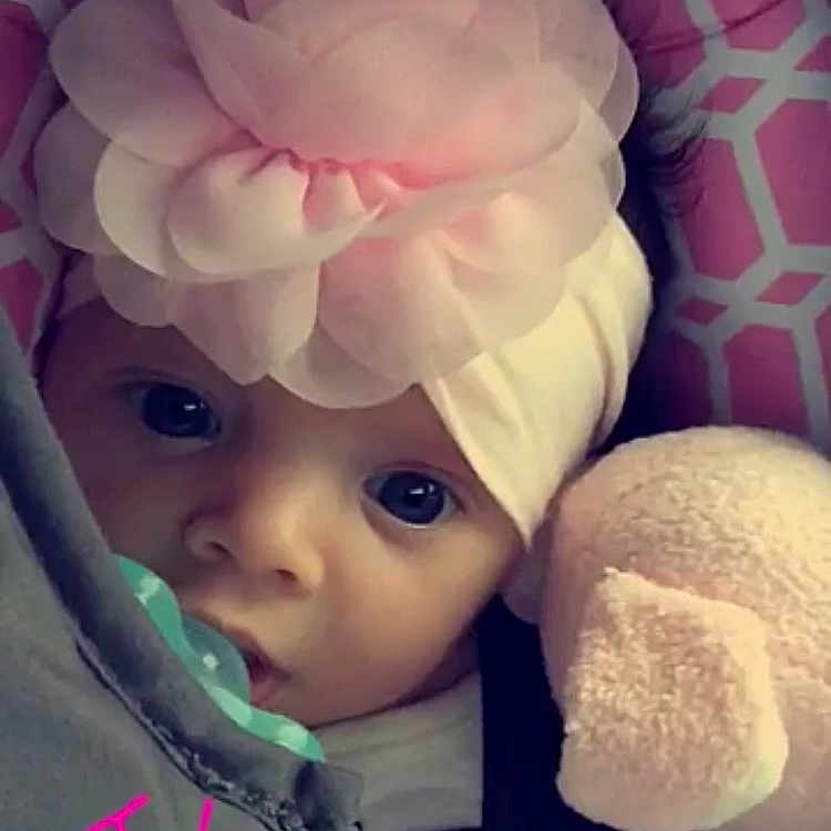 Ella Rae is registered to the contest to win money with this photo: baby, cheek, child, doll, head, headgear, person, pink, skin, toddler, toy