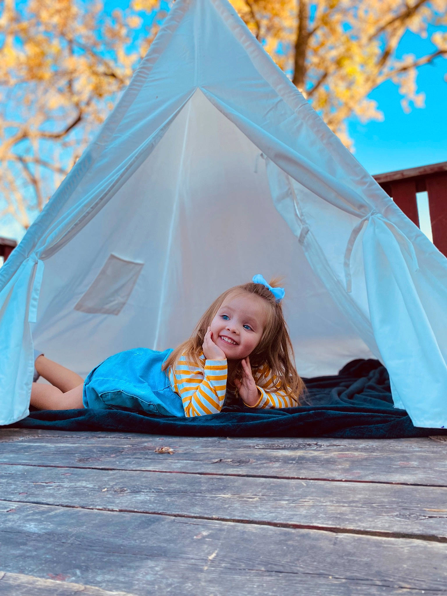 Ella Rae is registered to the contest to win money with this photo: azure, clothing, community, daytime, grass, happy, joy, leaf, leisure, outerwear, people_in_nature, person, plant, recreation, shade, style, sunlight, tarpaulin, tent, tree