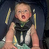 Atlas joined the competition — help win amazing prizes! baby, child, car_seat, seatbelt, infant, blue_eyes, blond_hair, safety, straps, clothing, blanket, hand, expression, indoor, cute, person, seat, young_child, face, portrait