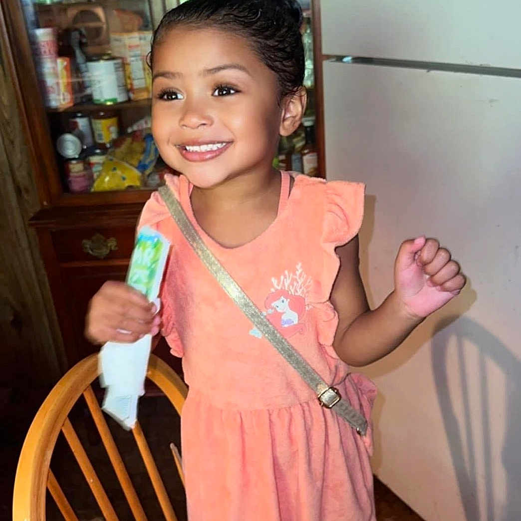 Iyanna is registered to the contest to win money with this photo: architecture, bodypart, building, cabinet, child, cutlery, diningroom, diningtable, face, female, finger, furniture, hand, head, indoors, person, photography, portrait, room, table