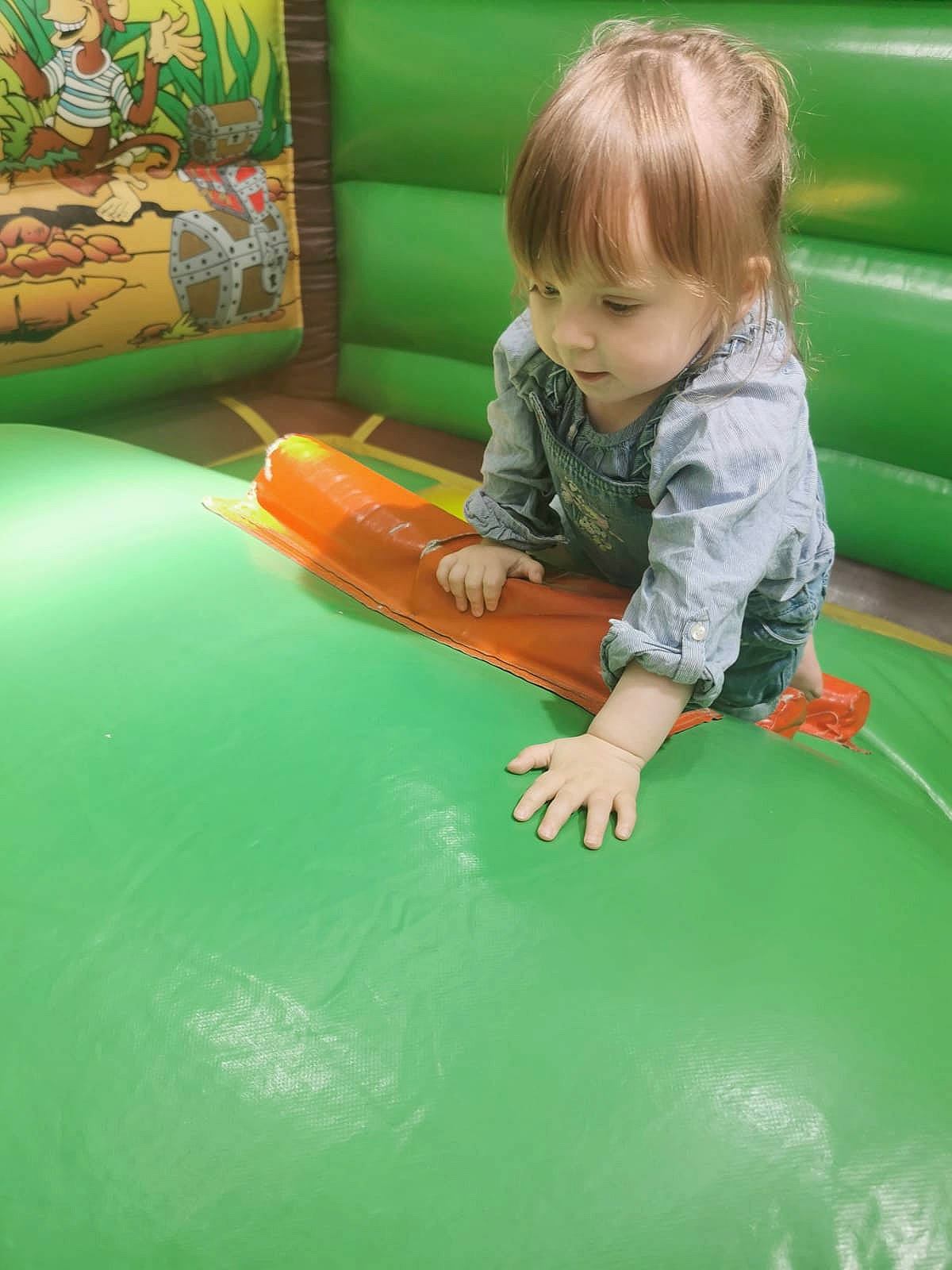 Orla joined the competition — help win amazing prizes! baby, child, chute, flooring, fun, grass, green, inflatable, leisure, outdoor_play_equipment, person, play, playground, recreation, room, shorts, sitting, snapshot, t_shirt, toddler