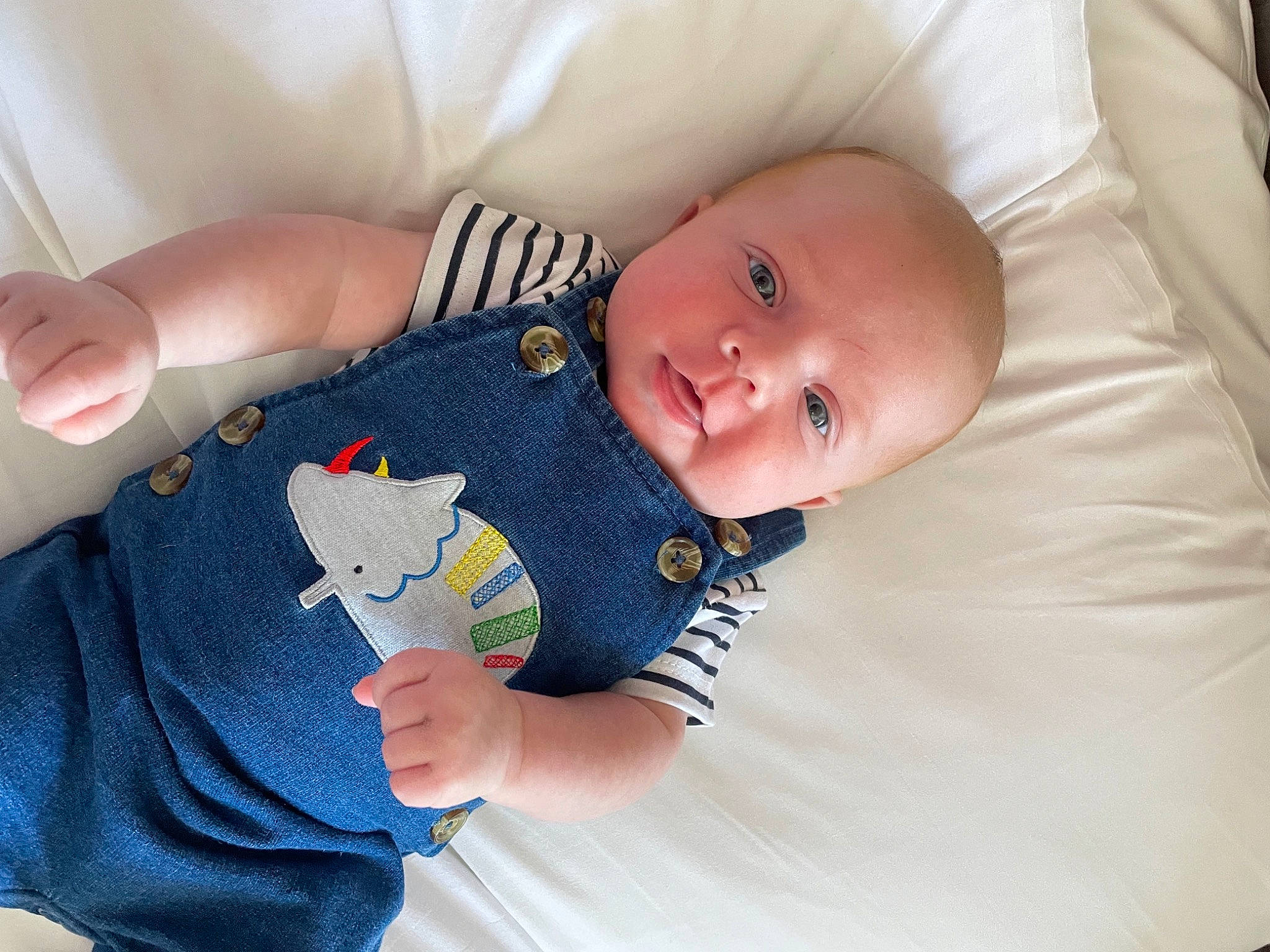 Alex joined the competition — help win amazing prizes! baby, baby_products, baby_sleeping, baby_toddler_clothing, cheek, child, comfort, elbow, finger, gesture, happy, human_body, linens, mammal, person, room, sitting, skin, sleeve, textile