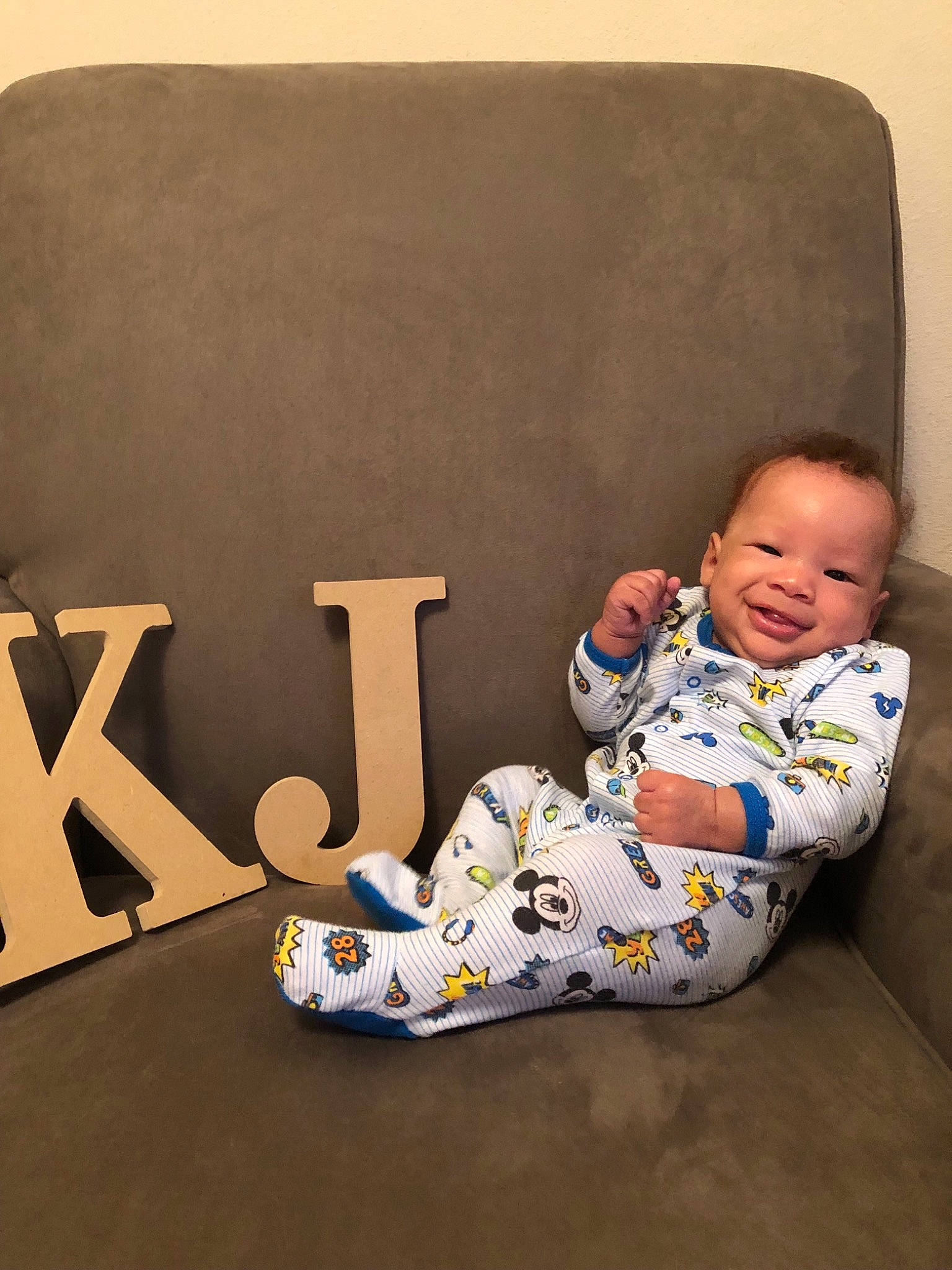 Kareem is registered to the contest to win money with this photo: child, furniture, infant, joy, person, play, product, sitting, toddler
