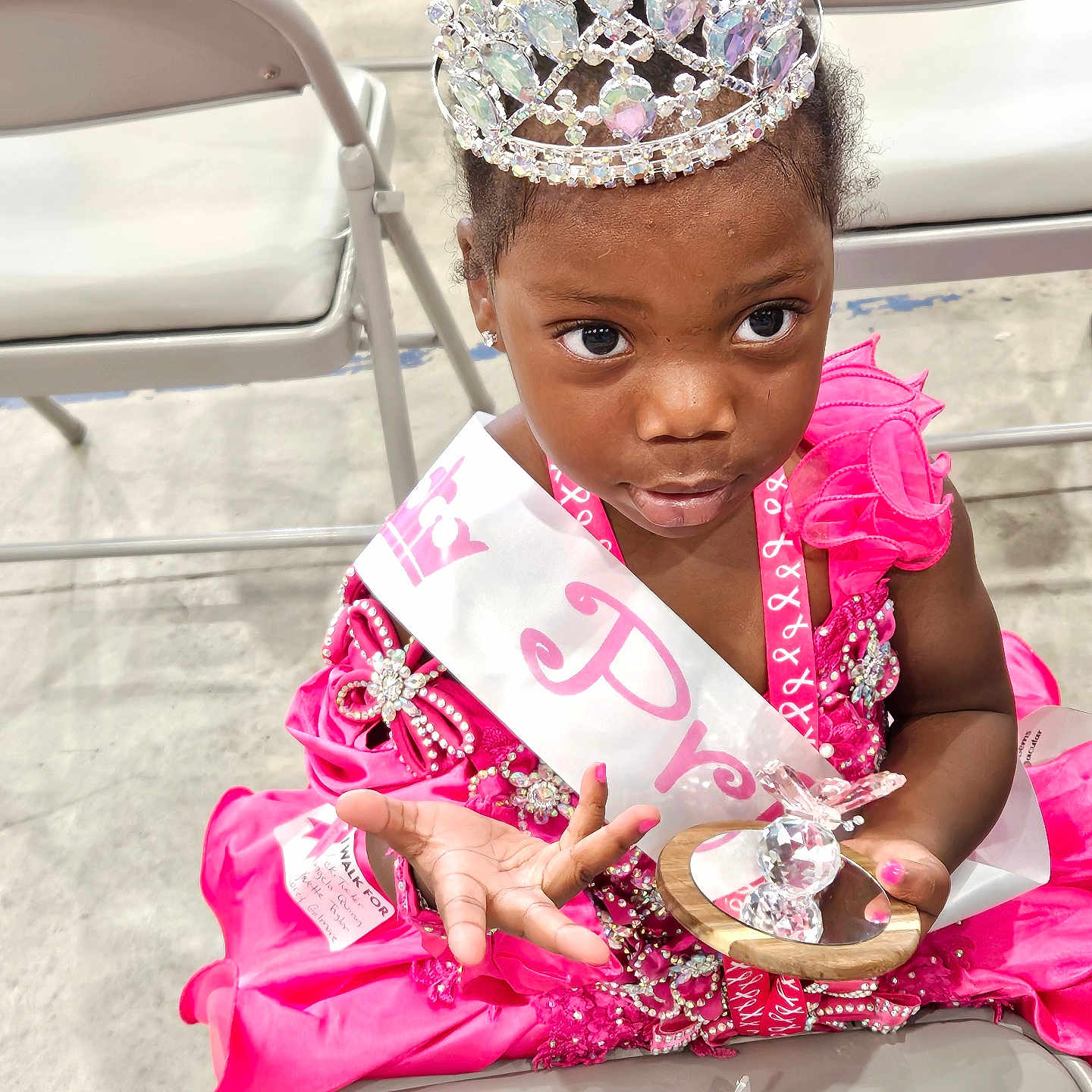 Ja'Niyah is registered to the contest to win money with this photo: accessories, brush, chair, child, device, diamond, face, female, furniture, gemstone, girl, head, jewelry, person, photography, portrait, ring, tiara, tool, toothbrush