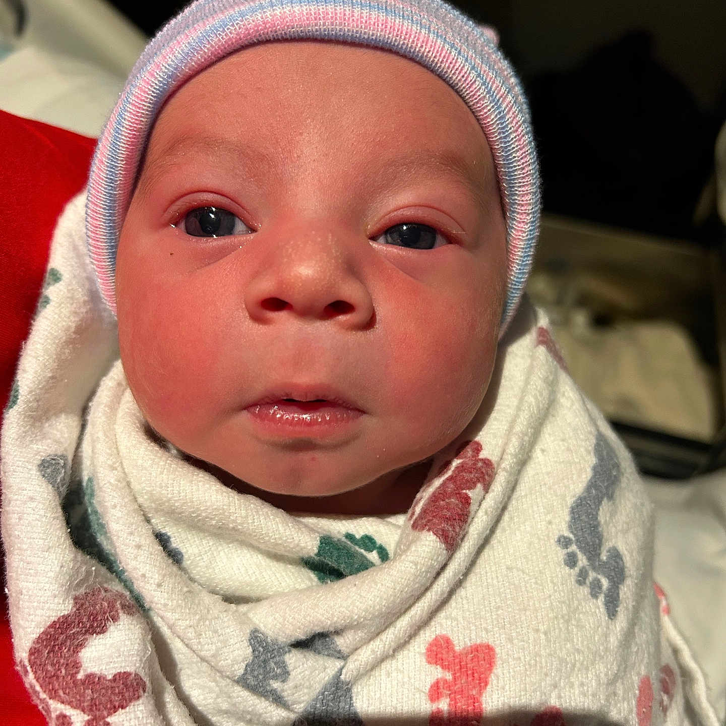 Littlejoe is registered to the contest to win money with this photo: adorable, baby, blanket, cap, close_up, cozy, eyes, face, footprint_pattern, hospital, hospital_blanket, indoor, infant, mouth, newborn, nose, portrait, skin, striped_cap, swaddle