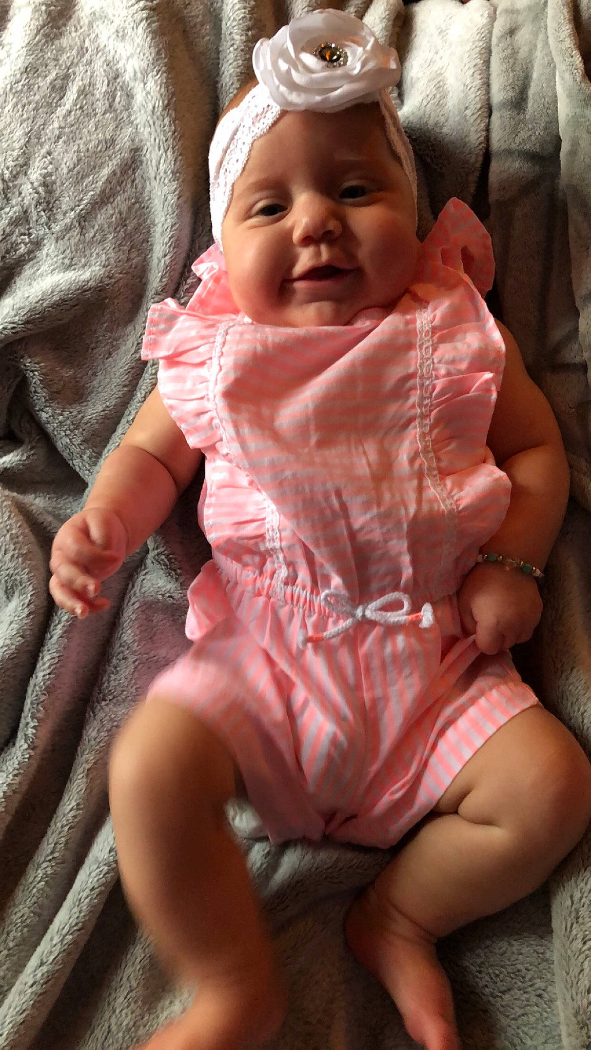 Brinlee is registered to the contest to win money with this photo: baby, cheek, child, facial_expression, hand, person, pink, sitting, skin, smile, toddler