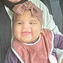 Serine joined the competition — help win amazing prizes! baby, smiling, headband, bow, bib, clothing, person, seatbelt, car_seat, happy, child, portrait, infant, cute, closeup, fabric, pink, purple, hand, holding
