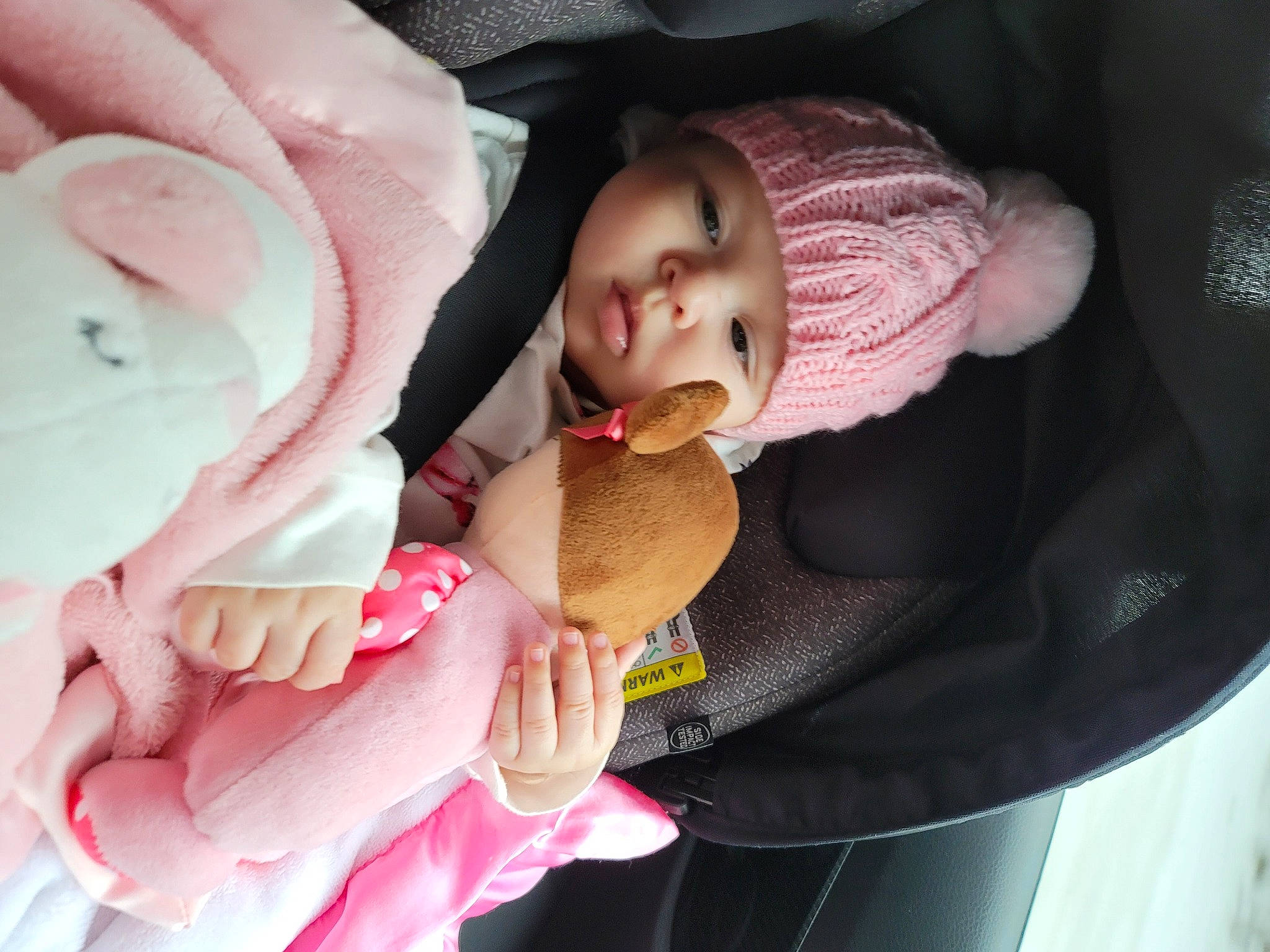 Nicole is registered to the contest to win money with this photo: baby, baby_carriage, baby_in_car_seat, baby_products, baby_safety, baby_toddler_clothing, cheek, child, comfort, finger, hand, headgear, headwear, linens, lip, nail, person, pink, seat_belt, skin