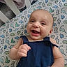 Dominic joined the competition — help win amazing prizes! baby, infant, smile, happy, crib, blanket, dinosaur_pattern, blue_clothing, cute, face, child, hand, lying_down, indoor, person, furniture, soft_texture, bed, portrait, toddler