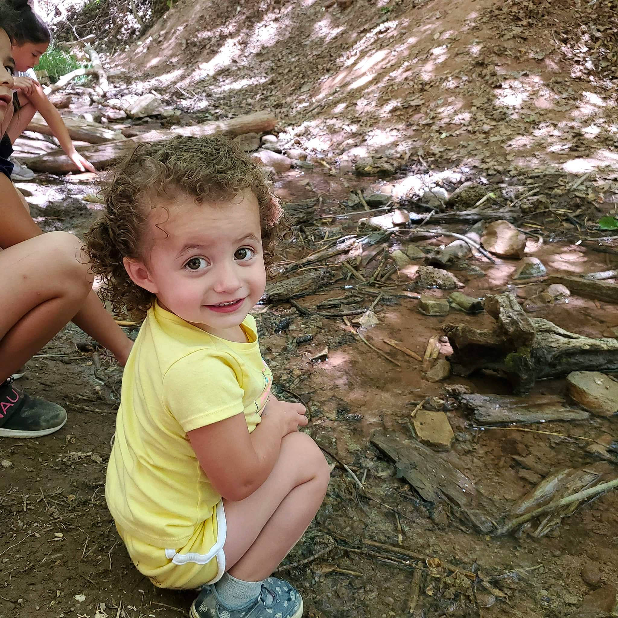 Joslyn is registered to the contest to win money with this photo: child, fawn, fun, joy, jungle, leisure, person, plant, rock, smile, tree, vacation