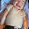 baby, infant, child, smiling, sleeping, portrait, face, indoors, bedding, blanket, pacifier, clothing, shirt, pants, nike, happy, lying_down, cozy, close_up, photography
