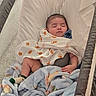 Josiah joined the competition — help win amazing prizes! baby, infant, sleeping, bassinet, blanket, swaddled, pacifier, portrait, indoors, nursery, cushion, fabric, soft, cozy, peaceful, face, closed_eyes, baby_clothing, elephant_pattern, resting