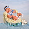 Delanis joined the competition — help win amazing prizes! baby, infant, smile, headband, blue, white, knit, chair, block, months, cute, portrait, studio, soft, cozy, flower, clothing, happy, child, socks