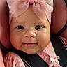baby, infant, pink_bow, car_seat, child, cute, portrait, closeup, smile, baby_clothes, soft_lighting, seatbelt, headband, chubby_cheeks, skin, hand, indoor, pink, adorable, young_child