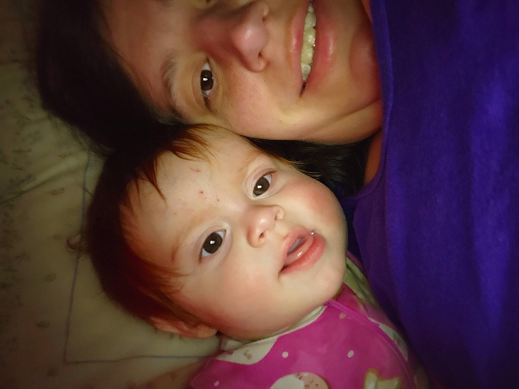 Emma is registered to the contest to win money with this photo: baby, black_hair, cheek, child, ear, eyebrow, eyelash, face, flash_photography, forehead, gesture, happy, iris, lip, mouth, nose, person, skin, smile, toddler