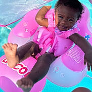 Zoya joined the competition — help win amazing prizes! amusementpark, baby, clothing, face, happy, head, inflatable, lifejacket, outdoors, person, photography, pool, portrait, purple, shorts, summer, swimmingpool, swimwear, vest, water