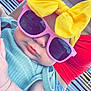 baby, child, sunglasses, yellow_bow, headband, pink_sunglasses, mint_green_clothing, denim_shorts, red_top, outdoor, bench, cute, chubby_cheeks, fashion, summer, portrait, person, casual, relaxed, sunny