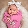 Myrah joined the competition — help win amazing prizes! adorable, baby, child, closeup, cozy, cute, dreamer_text, expression, floral_design, hands, headwear, indoor, infant, newborn, person, pink_sweater, portrait, skin, soft_cushion, white_bow