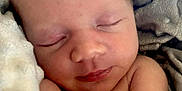 Faith is registered to the contest to win money with this photo: newborn, baby, sleeping, blanket, soft, peaceful, infant, skin, face, arm, closeup, resting, cute, young, child, portrait, comfort, warm, relaxation, tender