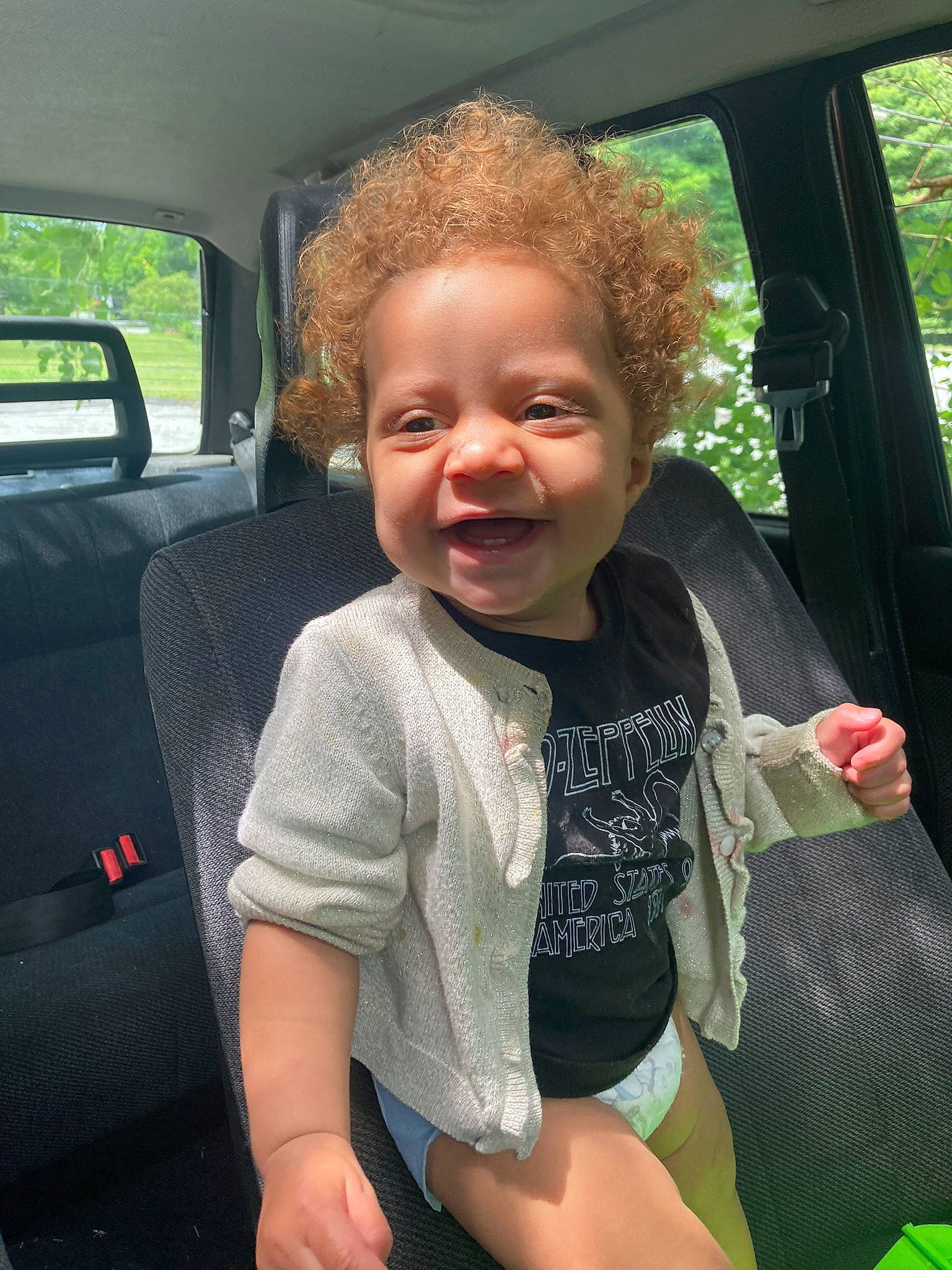 Isla joined the competition — help win amazing prizes! auto_part, automotive_exterior, car, car_seat, car_seat_cover, cool, finger, fun, grass, head, mode_of_transport, motor_vehicle, person, plant, seat_belt, smile, steering_wheel, summer, toddler, vehicle_door