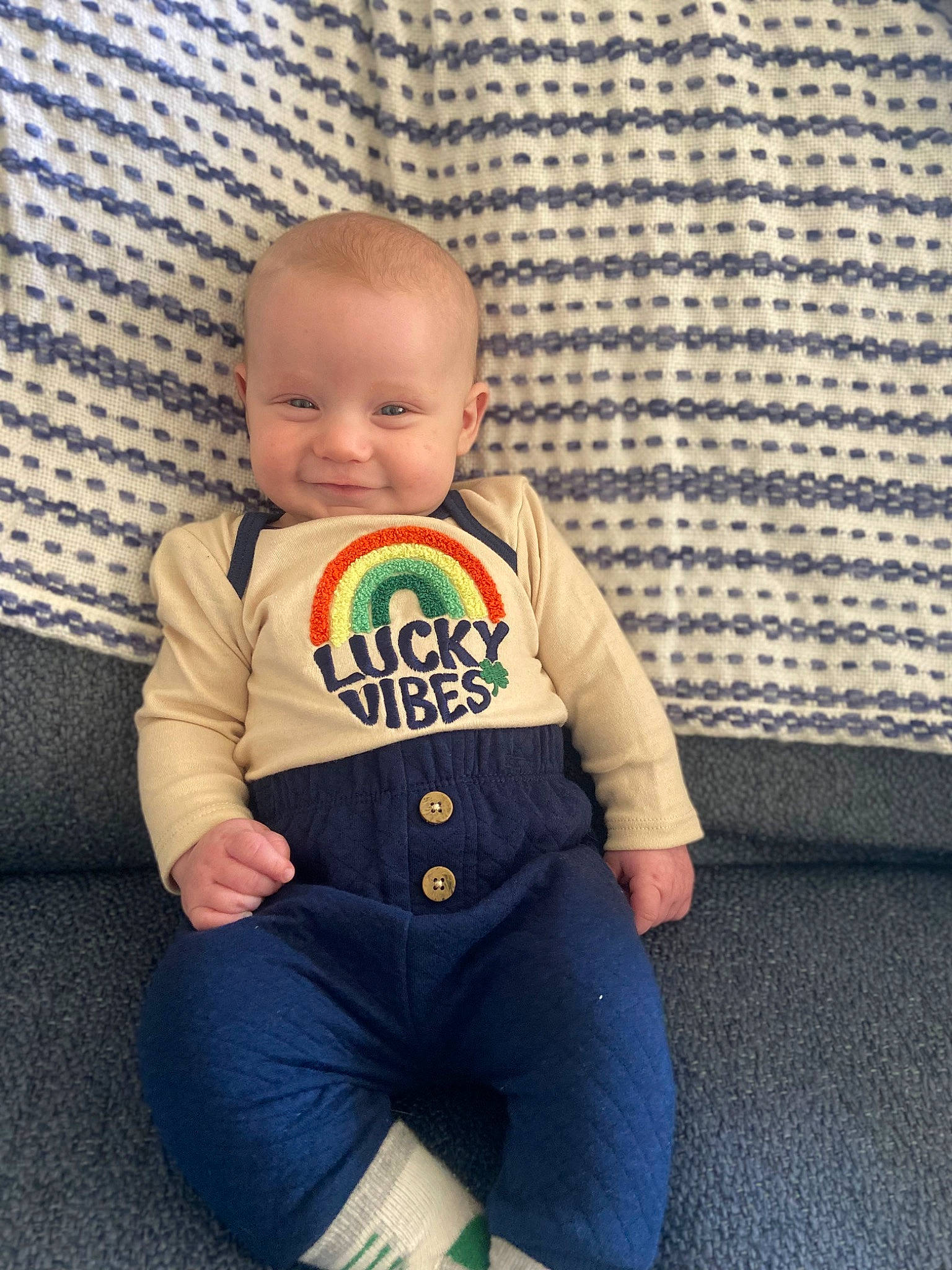 Kai joined the competition — help win amazing prizes! baby, baby_products, baby_toddler_clothing, cheek, child, clothing, comfort, electric_blue, eye, face, flooring, happy, joy, leg, person, sitting, skin, sleeve, smile, sportswear