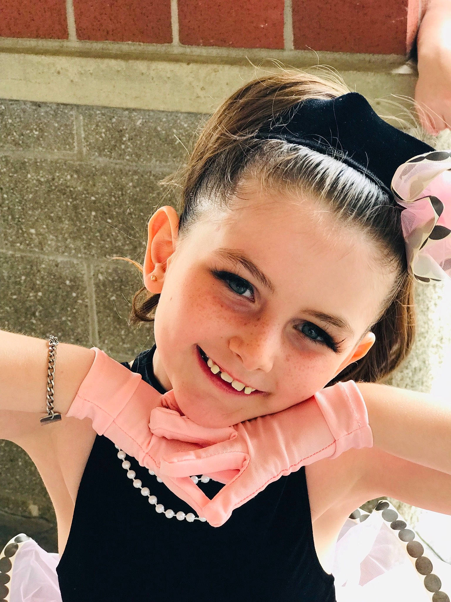 Aubrey joined the competition — help win amazing prizes! beauty, black_hair, brown_hair, child, child_model, dress, ear, eyebrow, eyelash, face, fashion_accessory, forehead, gesture, hair, hairstyle, hand, head, joy, neck, person