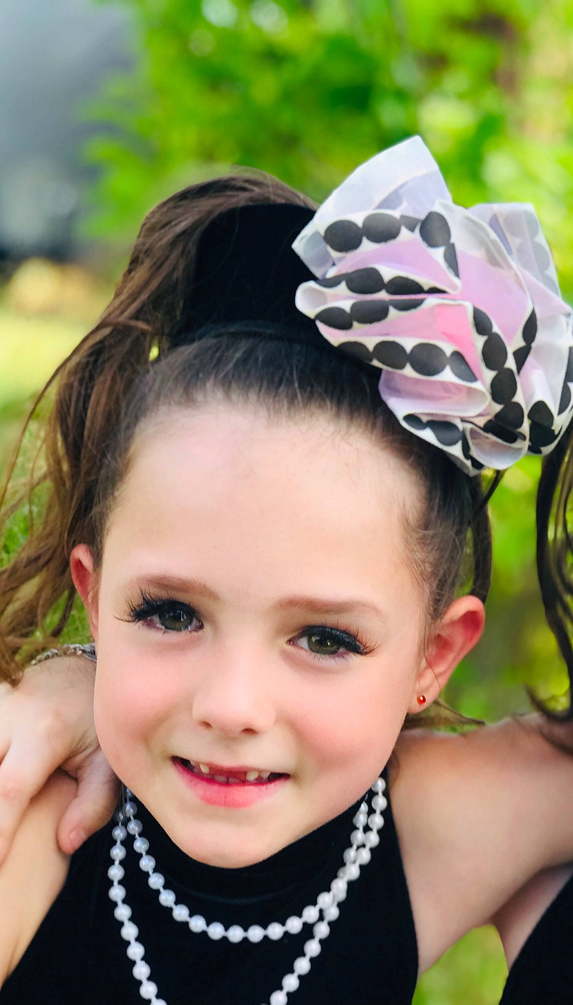 Brylie joined the competition — help win amazing prizes! child, child_model, clothing, costume_accessory, design, ear, face, fashion_accessory, hair, hair_accessory, hairstyle, hat, head, headband, headgear, headpiece, joy, pattern, person, pink